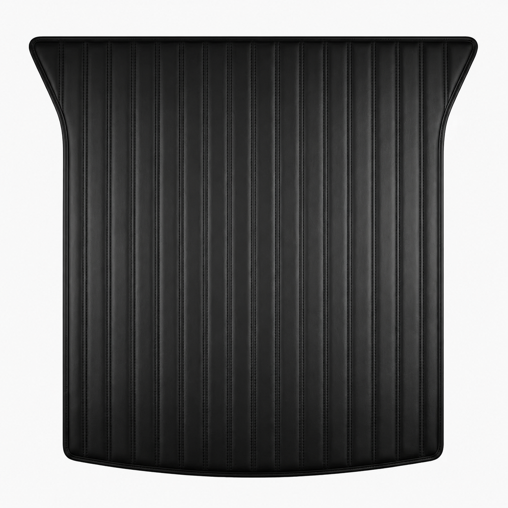 A black textured trunk liner with vertical ribbed grooves and curved outer edges, shown against a plain white background.