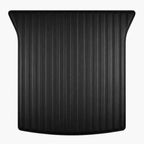 A black textured trunk liner with vertical ribbed grooves and curved outer edges, shown against a plain white background.